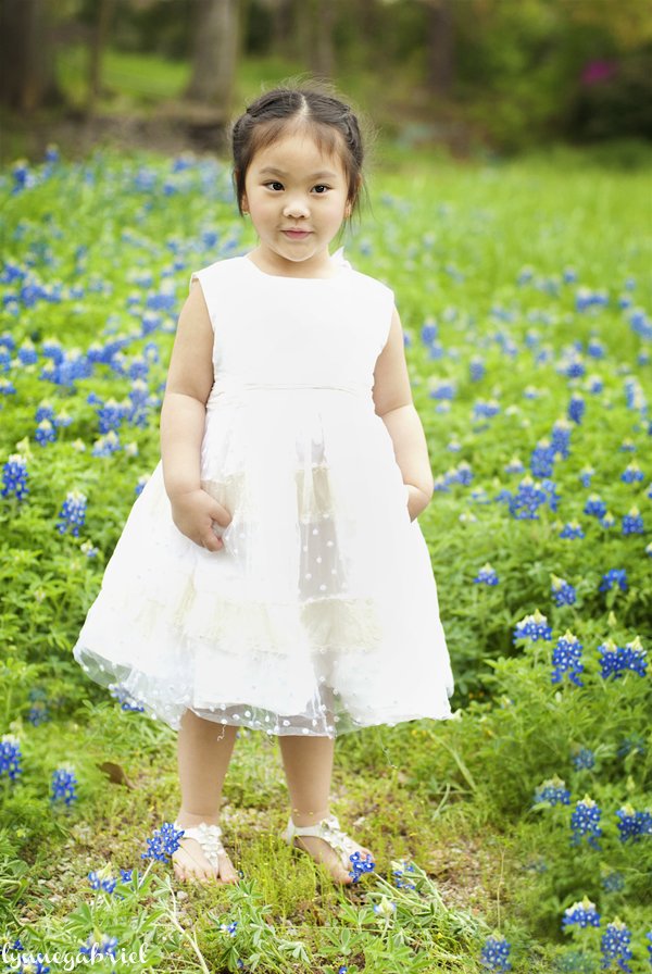 A Little Girl in a White BHLDN Dress